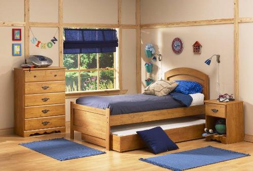 Wooden Bed with Extra Bedding in Teen Bedroom