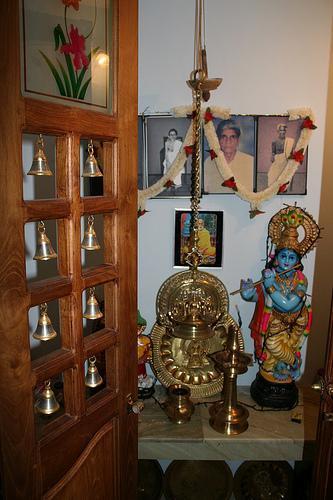 Wooden door with hanging Brass bells