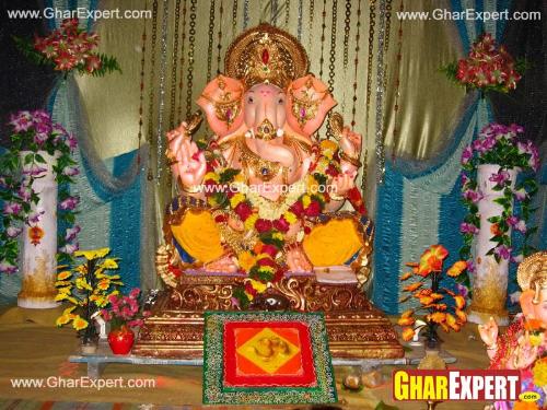 Ganpati decoration with colored cloth pieces and decorating string curtains